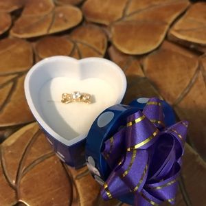 14k yellow gold bow adjustable with CZ stones.